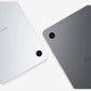 Two Samsung tablets shown from the back, one in silver and one in dark gray, on a clean white background.