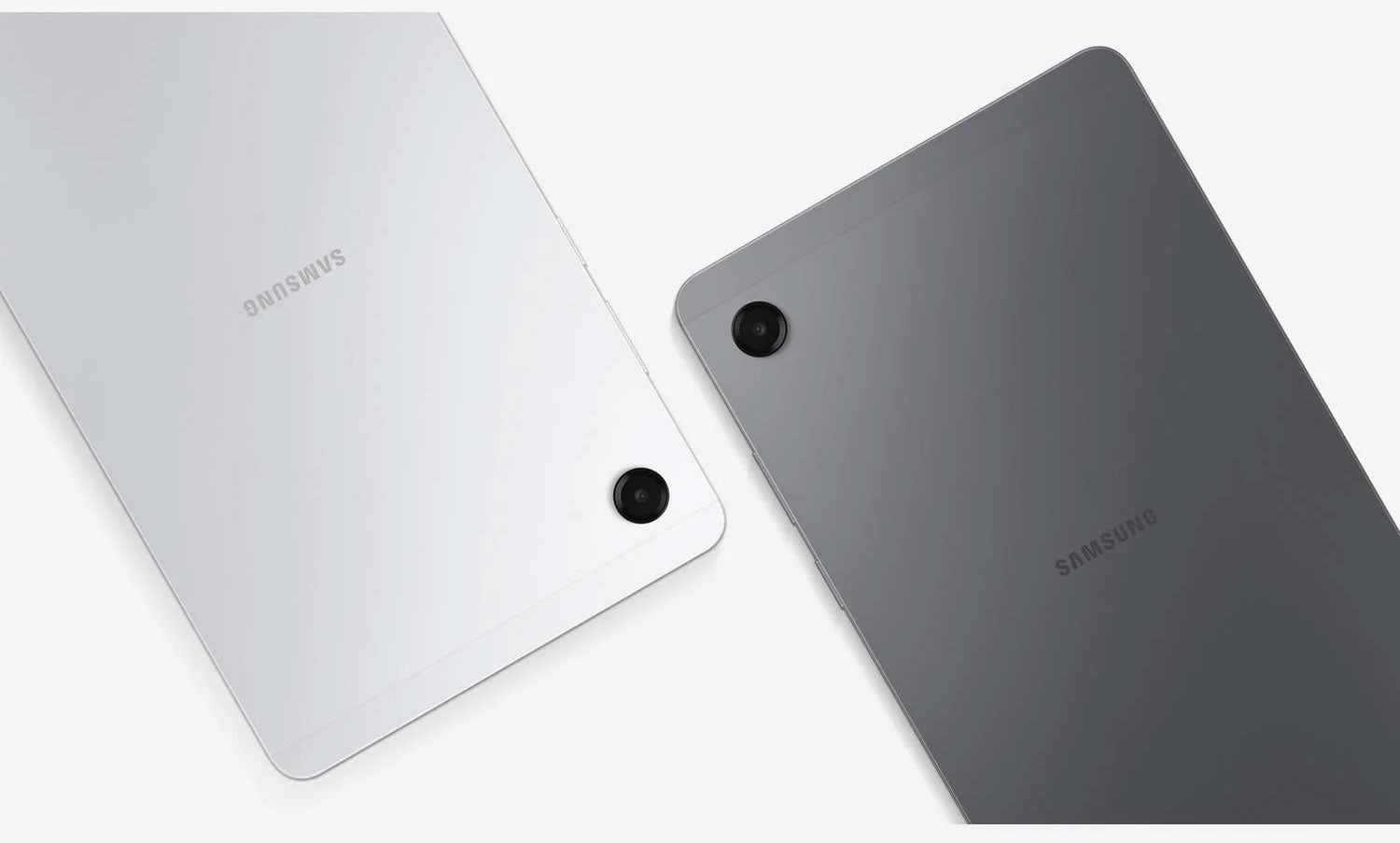 Two Samsung tablets shown from the back, one in silver and one in dark gray, on a clean white background.